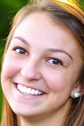 Patient from Waynesboro showing off her brand new tooth veneers.