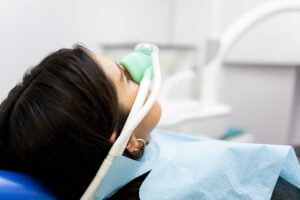 patient undergoing sedation during a modern dental treatment