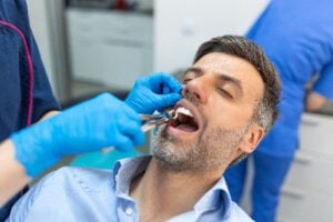 man having his tooth pulled