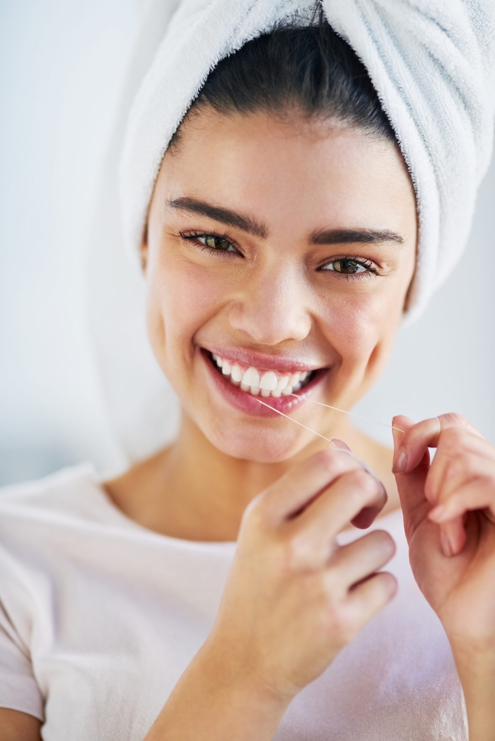 young woman showing her perfect smile in the mirror, cosmetic dental