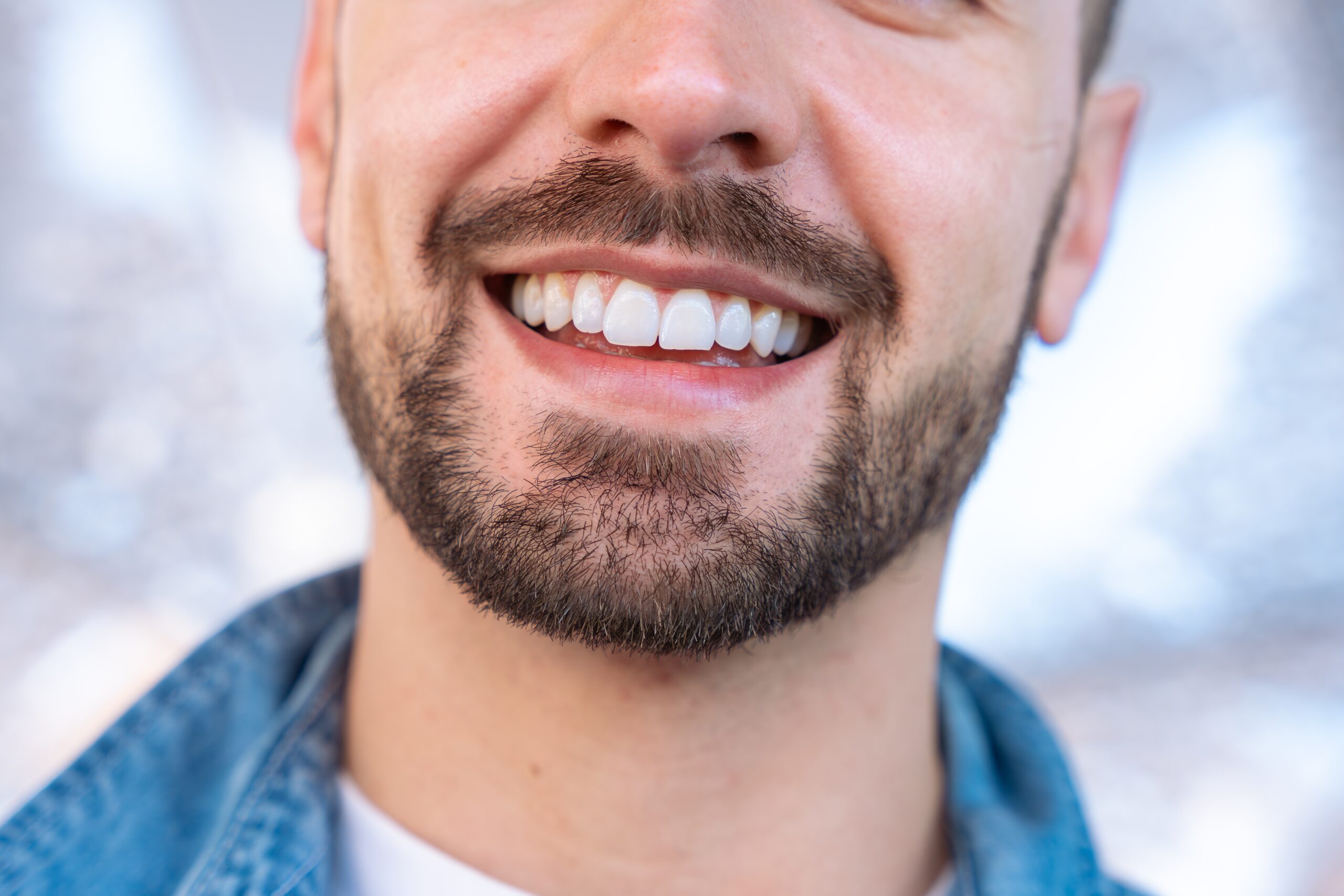 closeup of bearded man smiling, perfect white teeth